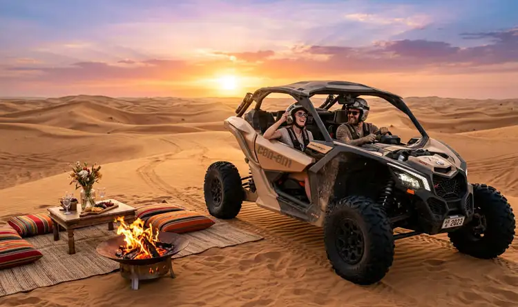 A couple laughing inside a tan Can-Am buggy parked next to a cozy desert setup featuring a warm fire pit, floor cushions, and snacks during an Abu Dhabi sunset.
